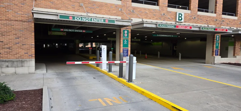 Hospital barrier gate access control system at urgent care parking entrance — Parking BOXX installation