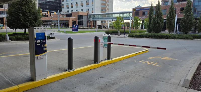 Parking BOXX pay station and barrier gate at University of Michigan Health medical campus parking entrance