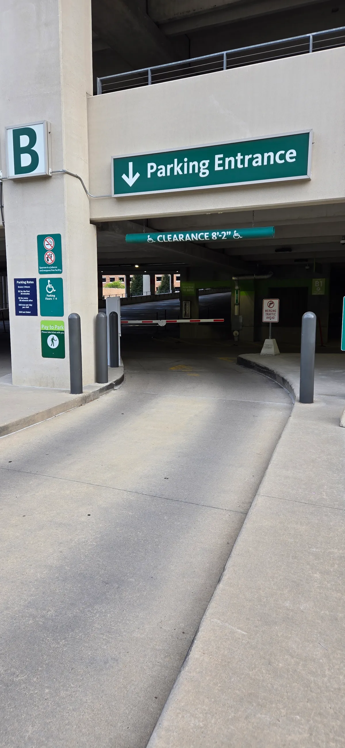 Parking BOXX gated entrance and ticket machine at a multi-level parking garage